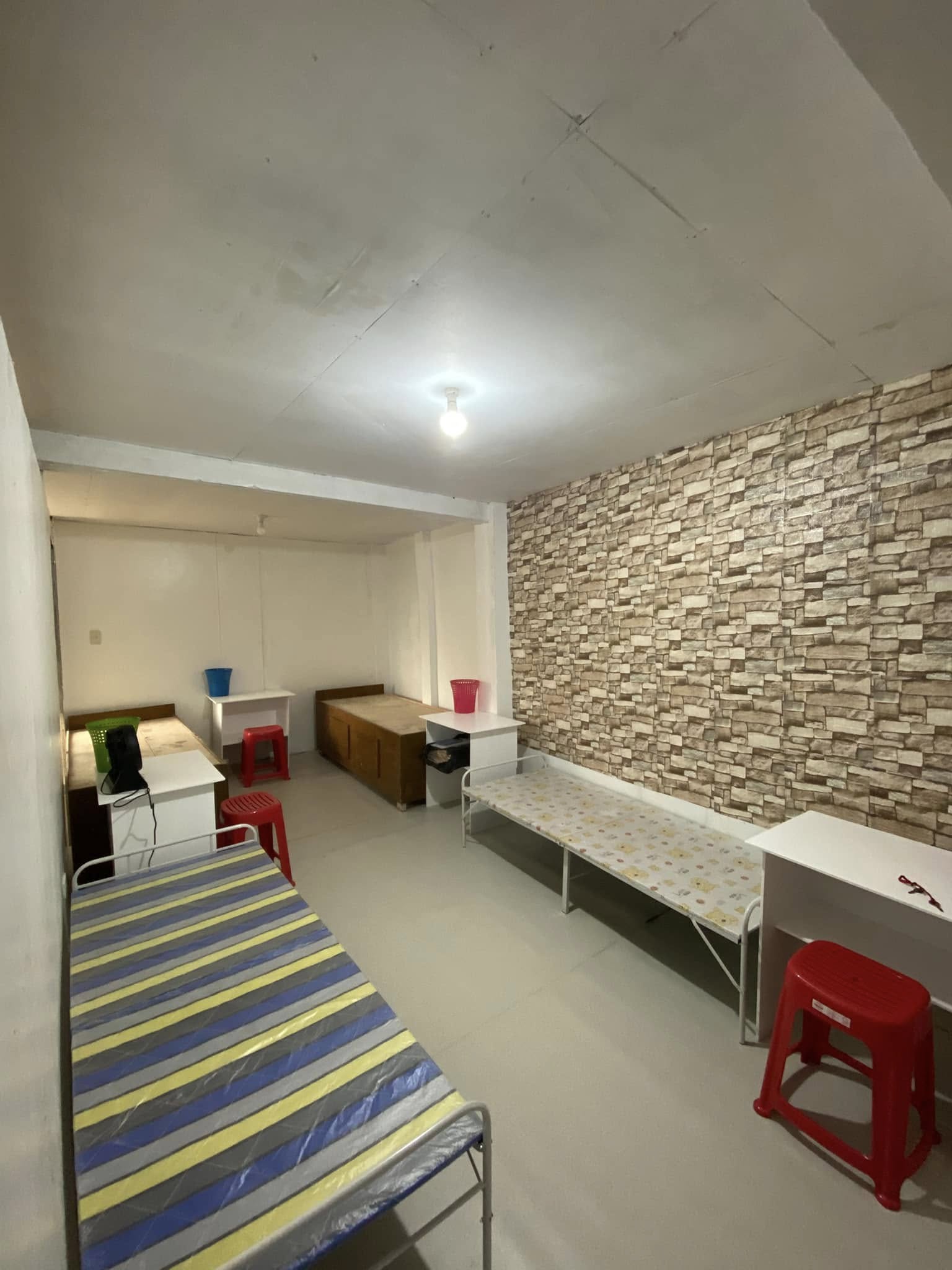 Clean and comfortable bed spacer with your own bed and cabinet in a shared room setting